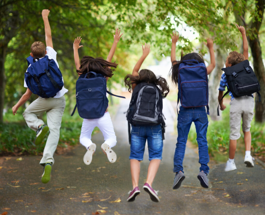 Spring break! children jumping as school is over