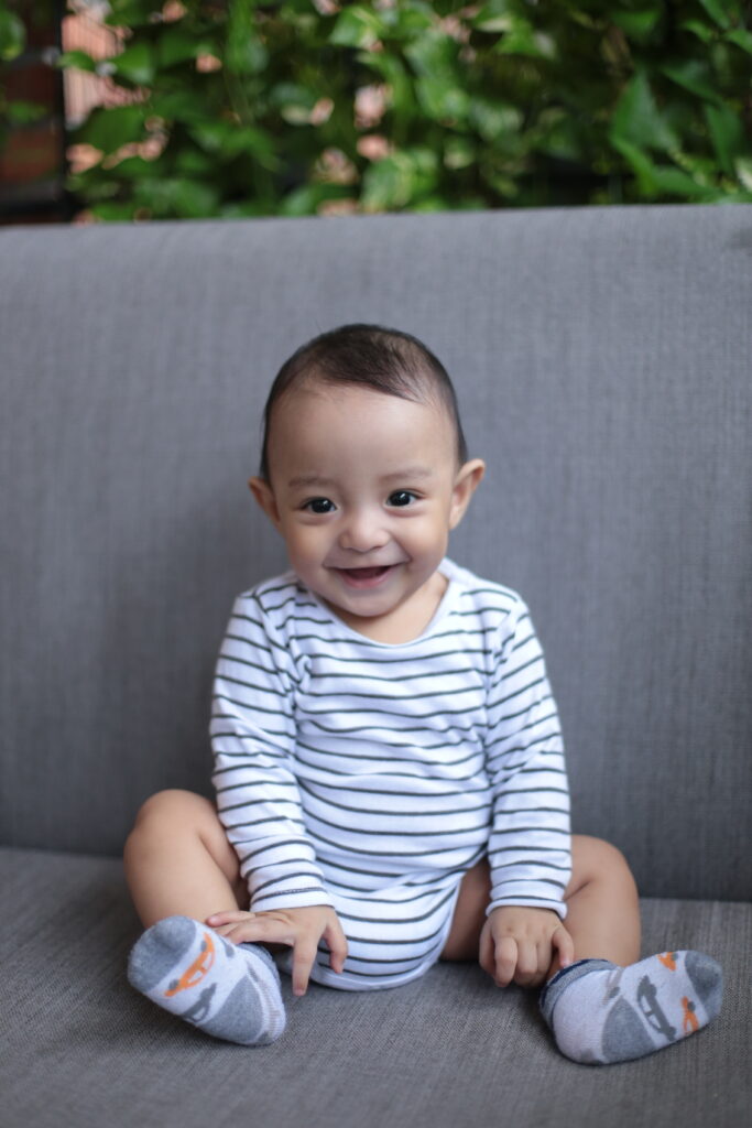 baby-smile-2024-10-17-02-43-46-utc baby sitting by himself