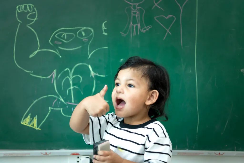 a young boy happy at school