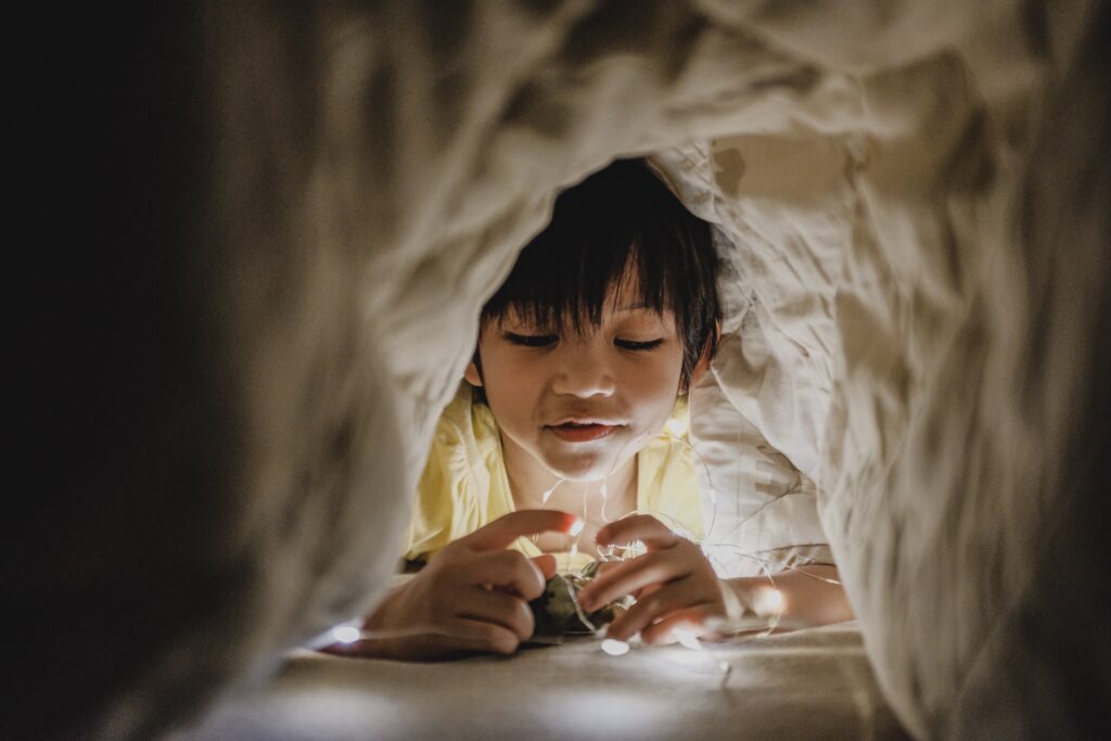 child playing in a home made obstacle path instead of screentime